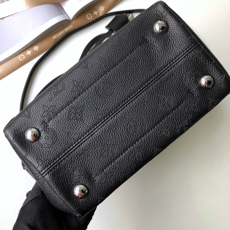Side profile of everyday-luxe polished women's handbag – women's luxury handbag