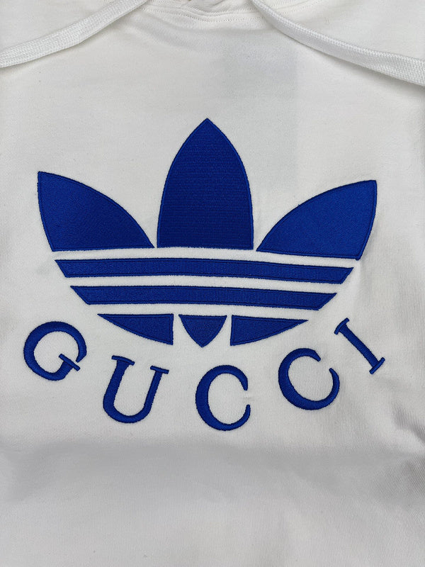 Full styled look of Gucci luxury clothing with monogram-inspired silhouette