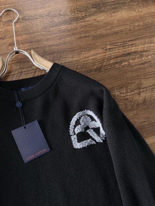 Close-up detail shot of Louis Vuitton luxury clothing with logo-detail design