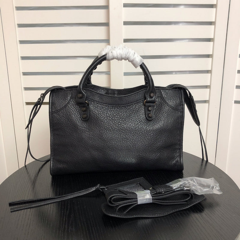 Front view of structured polished women's handbag – women's luxury handbag