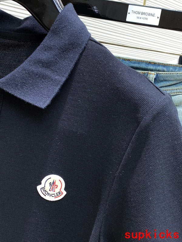 Full styled look of Moncler luxury clothing with signature branding
