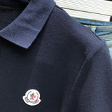 Full styled look of Moncler luxury clothing with signature branding