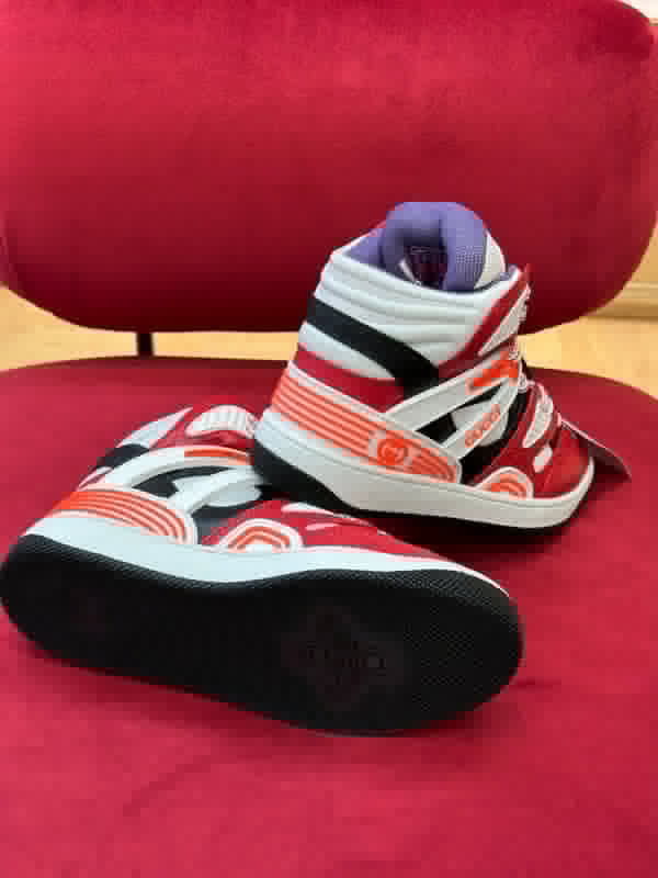 Side profile of Gucci muted earth tones sneakers heritage-inspired look