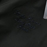 Flat lay presentation of Louis Vuitton luxury clothing with signature branding