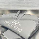 Handle and strap detail of statement polished women's handbag – women's designer-style accessory
