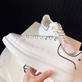 Alexander McQueen shoes Style 022 - front view, statement logo accent