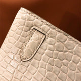 Side view of poised structured handbag