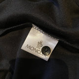 Side profile of Moncler luxury clothing with tailored silhouette