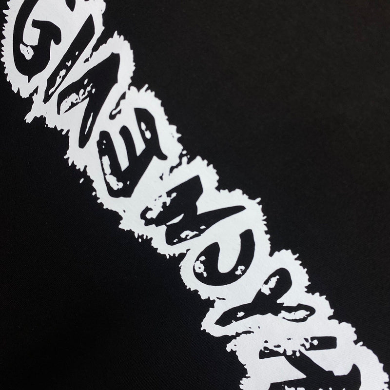 Flat lay presentation of Givenchy luxury clothing with monogram-inspired silhouette