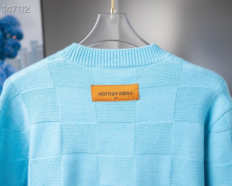 Close-up detail shot of Louis Vuitton luxury clothing with tailored silhouette