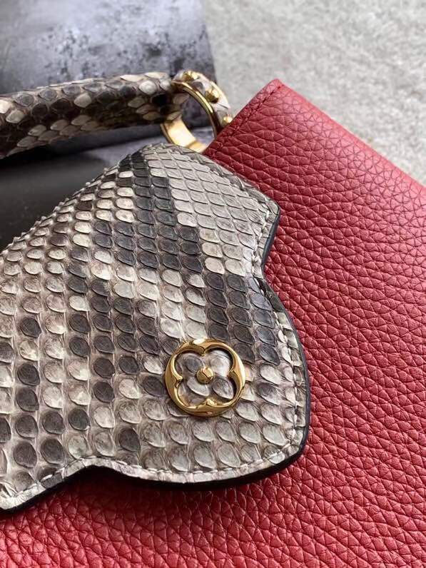 Handle and strap detail of elevated polished women's handbag – women's luxury handbag