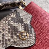 Handle and strap detail of elevated polished women's handbag – women's luxury handbag