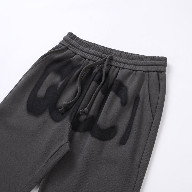 Close-up detail shot of Gucci luxury clothing with monogram-inspired silhouette