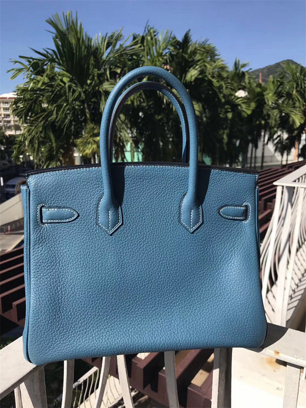  classic top-handle bag detail view showing craftsmanship