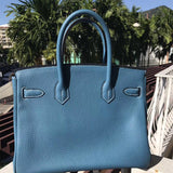  classic top-handle bag detail view showing craftsmanship