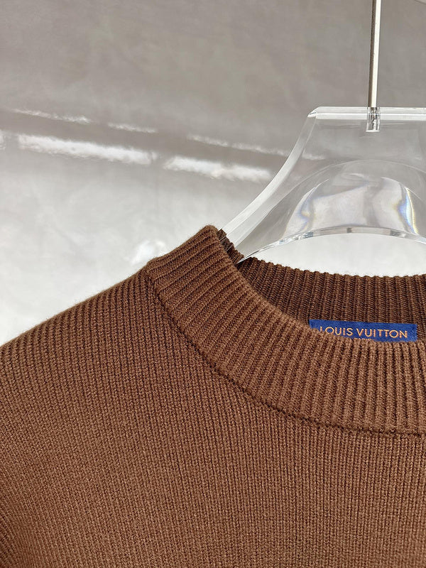 Close-up detail shot of Louis Vuitton luxury clothing with tailored silhouette