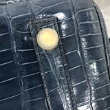 Side view of polished structured handbag