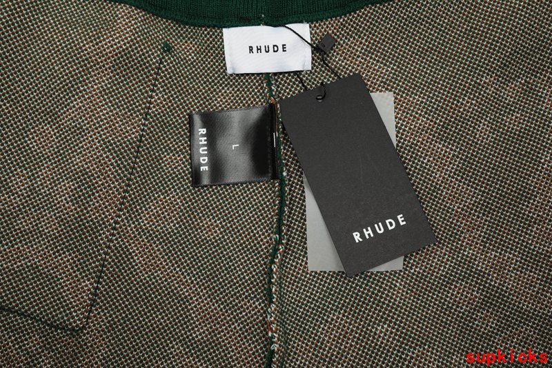 Close-up detail shot of Rhude luxury clothing with label-forward styling
