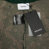 Close-up detail shot of Rhude luxury clothing with label-forward styling