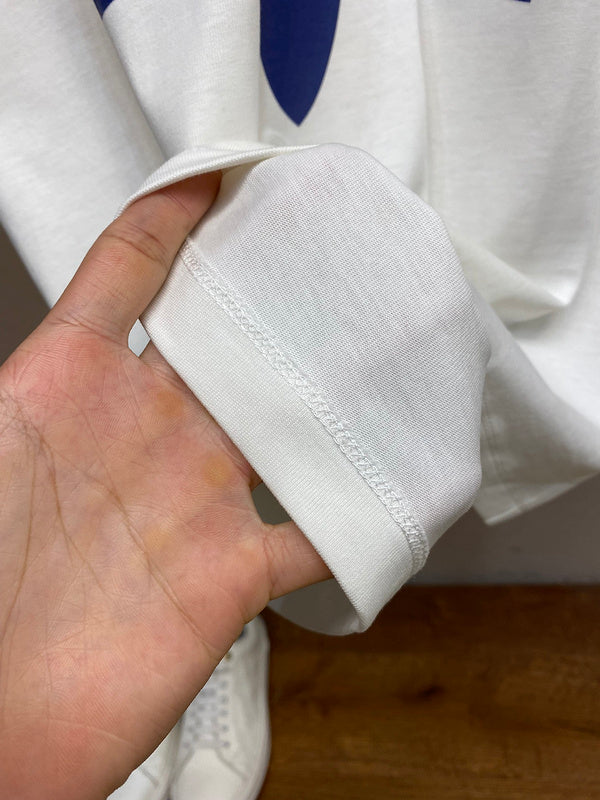 Side profile of Gucci luxury clothing with signature branding