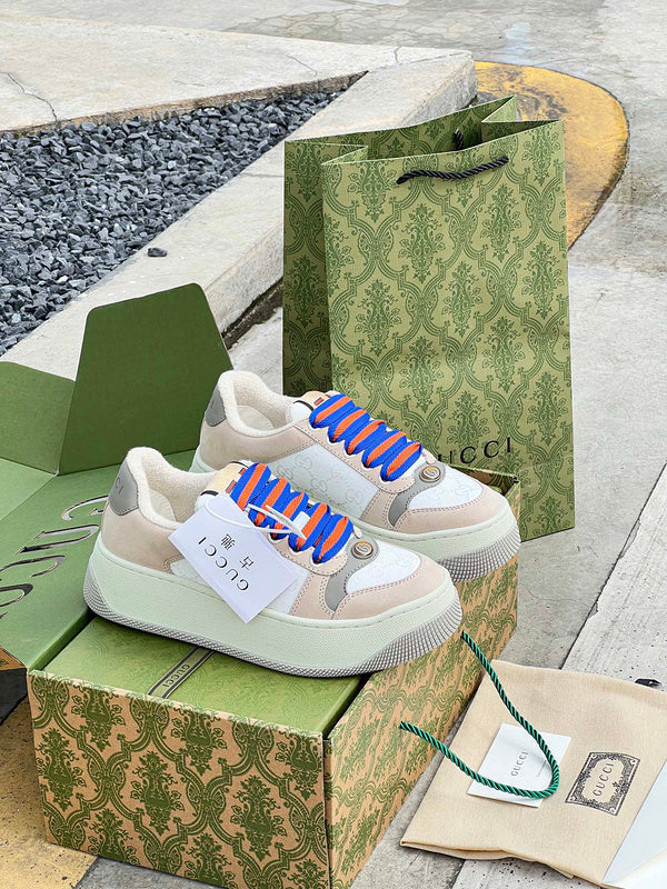 Gucci Designer sneakers in bold contrast breathable knit upper front view