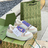 Gucci Designer sneakers in bold contrast breathable knit upper front view