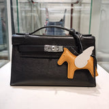 Side view of sculpted structured handbag