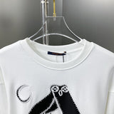 Close-up detail shot of Louis Vuitton luxury clothing with streetwear-inspired cut