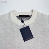 Close-up detail shot of Louis Vuitton luxury clothing with runway-inspired design