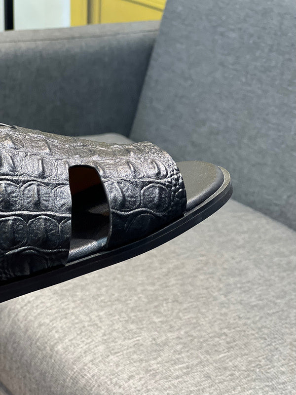 Hermès Black Low-Top Sneakers - Angled View