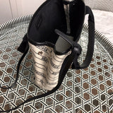 Back view of refined chic women's handbag – women's luxury handbag