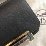 Side view of sculpted structured handbag
