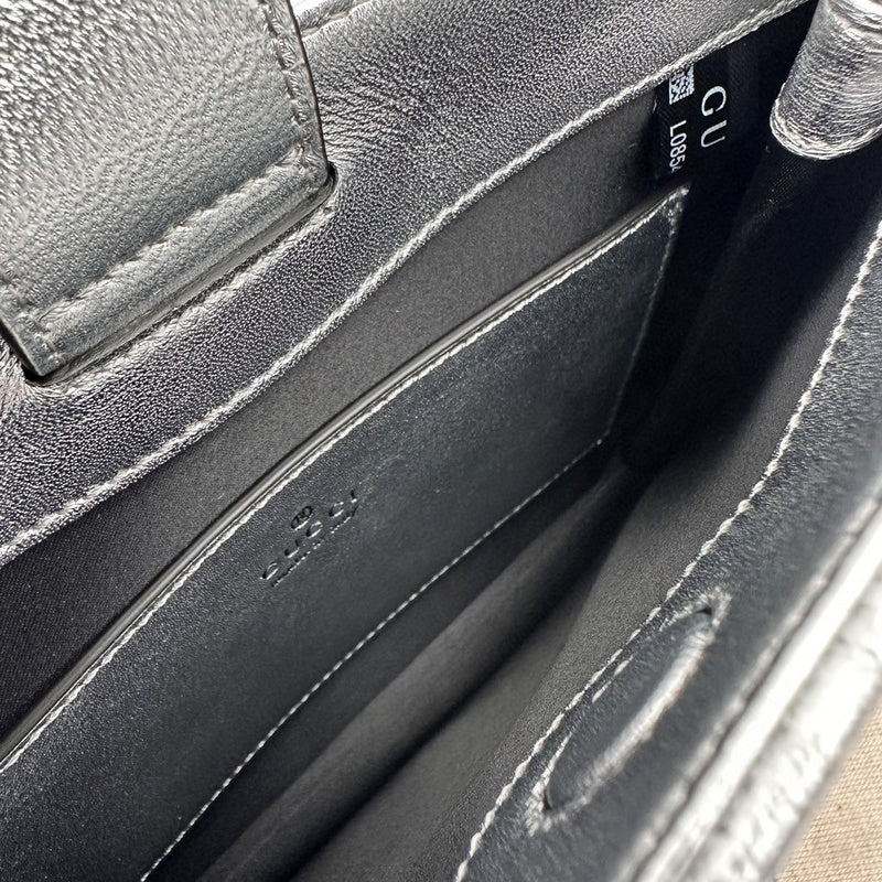 Styled lifestyle shot of classic refined women's handbag – women's everyday handbag