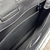 Styled lifestyle shot of classic refined women's handbag – women's everyday handbag