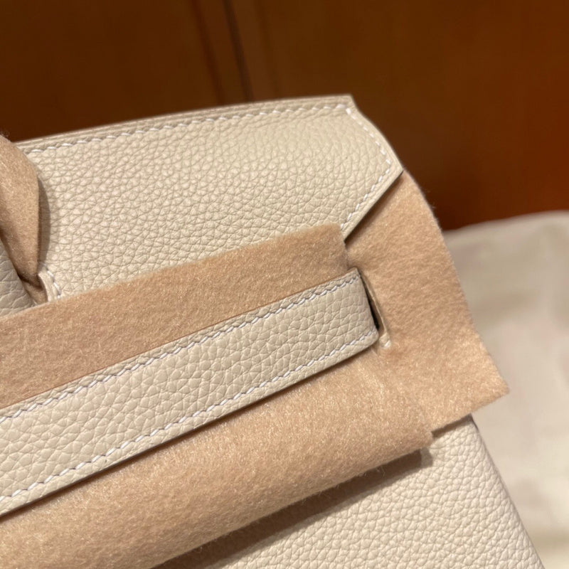 Side view of curated structured handbag