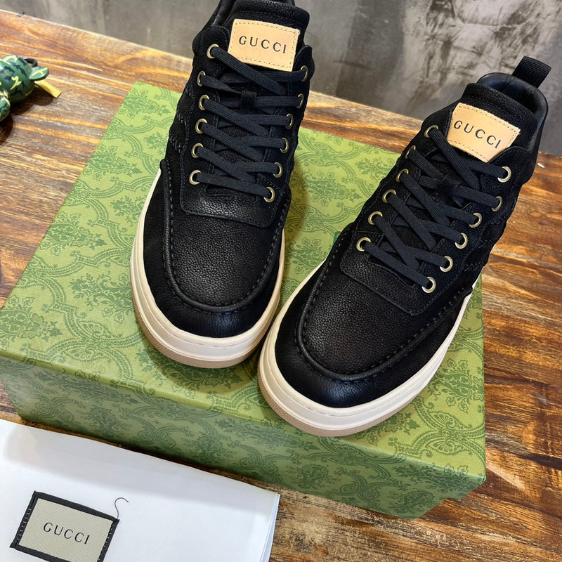 Side profile of Gucci tonal black sneakers premium leather build