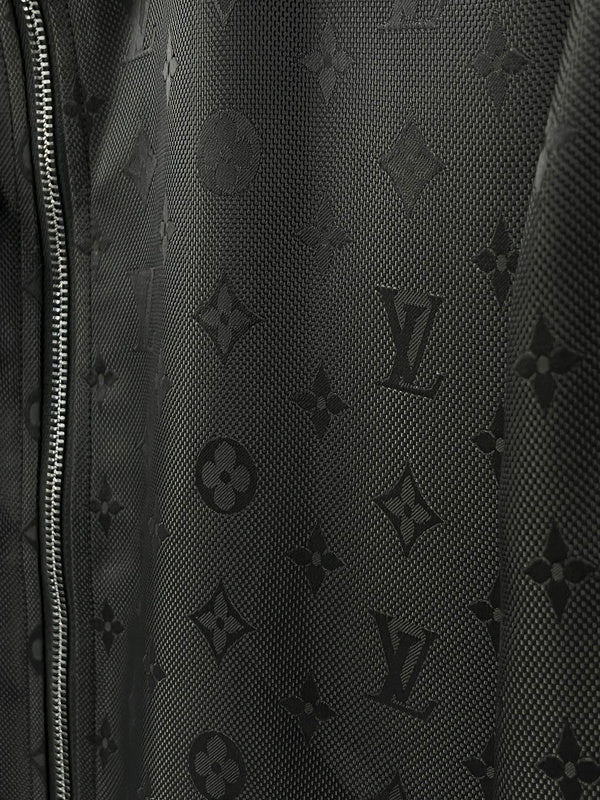 Flat lay presentation of Louis Vuitton luxury clothing with label-forward styling