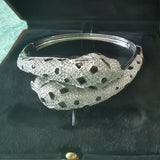 Side view of Cartier unisex jewelry piece