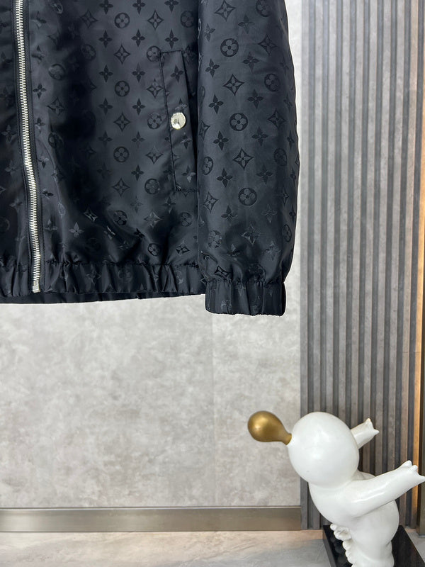 Close-up detail shot of Louis Vuitton luxury clothing with label-forward styling