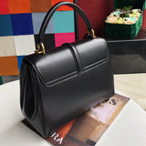 Handle and strap detail of modern classic women's handbag – women's designer-style accessory