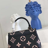 Handle and strap detail of elevated modern women's handbag – women's everyday handbag