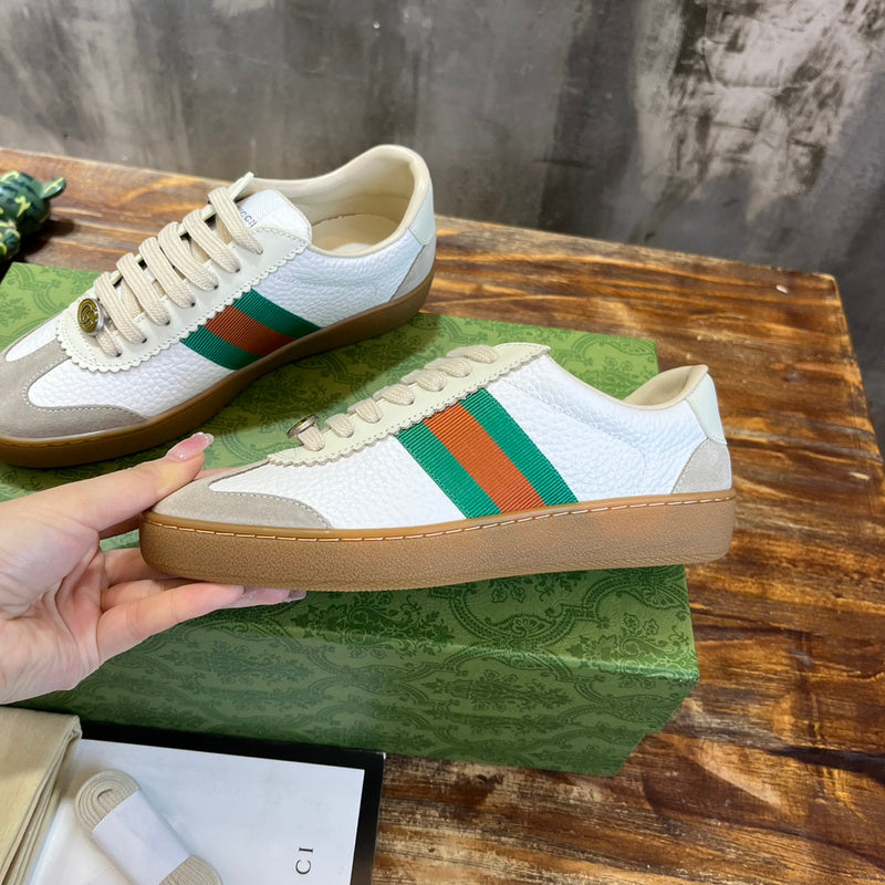 Side profile of Gucci bold contrast sneakers signature lace-up style
