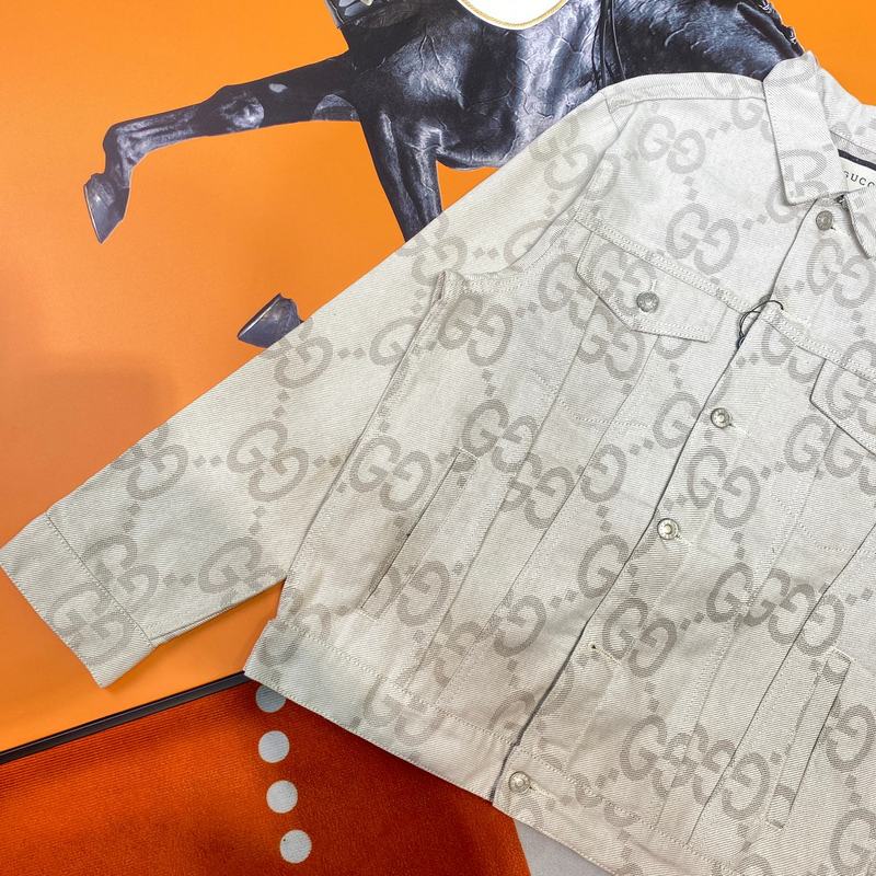 Close-up detail shot of Gucci luxury clothing with logo-detail design