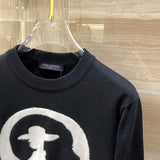 Close-up detail shot of Louis Vuitton luxury clothing with runway-inspired design