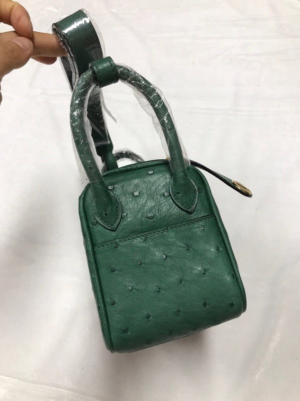 Side view of curated structured handbag