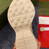 Side profile of Gucci soft grey sneakers padded collar comfort