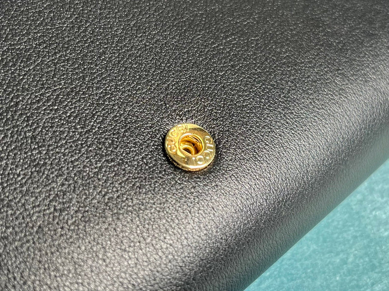 Styled lifestyle shot of polished classic women's handbag – women's luxury handbag