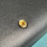 Styled lifestyle shot of polished classic women's handbag – women's luxury handbag
