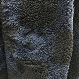 Full styled look of Louis Vuitton luxury clothing with signature branding