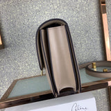 Styled lifestyle shot of modern classic women's handbag – women's luxury accessory